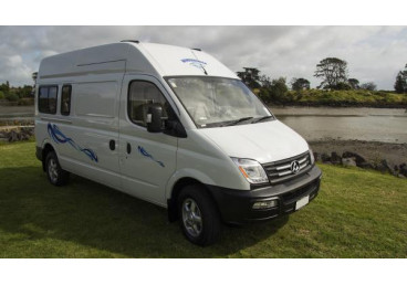 Built on the well known LDV V80, Budget 2 berth campervan with shower and toilet, features innovative and qualitative accommodation on wheels for up to three individuals. With a fuel consumption of approximately 9 litres per 100 kilometres and diesel road user charges included, this campervan is extremely economical when travelling New Zealand.
The rear bed is large enough to accommodate 2 adults and 1 child or three adult friends (1.83m X 1.81m). The passenger airbag can be switch-disabled if this is needed for rear facing child restraints. These features allows parents with young children to economically explore New Zealand.
The Budget 2 campervan was handcrafted by using range of modern materials and appliances. The entire interior furniture is made from durable plywood, covered by hard wearing yet visually attractive Formica veneer. The appliances include a 85l fridge, 2 stove gas cooking, a shower toilet cubicle, a large and comfortable bed and generous storage compartments.
Standard features include LPG central gas heating as well as a 12V power supply and two USB ports. Two roof vents help to ventilate the vehicle. The TV is hardwired into a Bluetooth radio and the rear speakers (4X50W).
The hot water is powered by a heat exchanger, connected to the vehicle cooling system. There is no need for gas or any other fuel to heat water. Once the engine reaches operating temperature, the in-house water will be hot for a period of up to 24 hours.
The on-board dual house battery system provides a generous 2.88-kilowatt hours of battery storage. Combined with a quality alternator and 240 volt charging system, this vehicle will not disappoint when freedom camping.
This vehicle is certified self-contained in accordance with the Plumbers, Gas and Drain Fitters (Self-Contained Vehicles) Regulations 2023 (the new rules - green warrant).